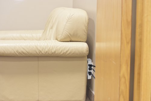 Globe Electric 6 Outlet Swivel behind couch